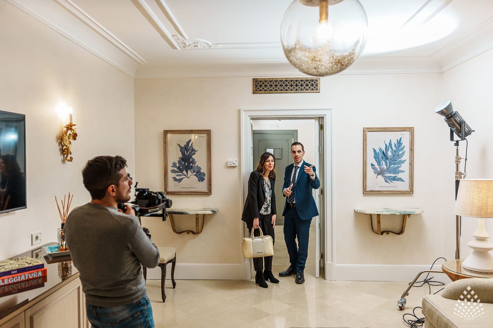 The crew filming a guest arrival in a corridor at Villa Sant'Andrea